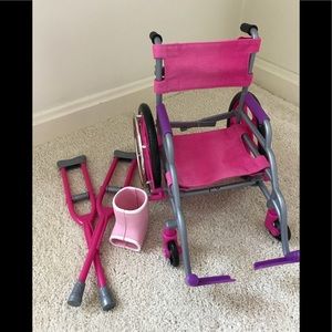 Doctor is in!  Wheelchair, crutches and leg cast!